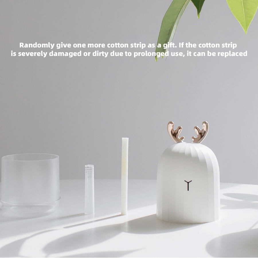 Deer humidifier accessories layout including the water tank, cotton strip, and main unit, with a free extra cotton strip included as a gift.