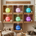 Embrace a symphony of scents and colors with the mini diffuser displaying 7 vibrant LED light modes in wooden shelves, with a sleeping cat below.