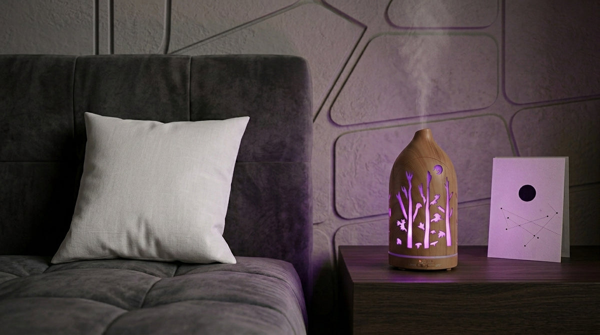 Light wood grain forest cutout diffuser emitting a cool purple LED light on a dark wooden nightstand in a modern bedroom with geometric wall panels and a constellation card.