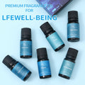 Premium essential oil set for life well-being, displaying 6 blend varieties scattered on a light blue background.