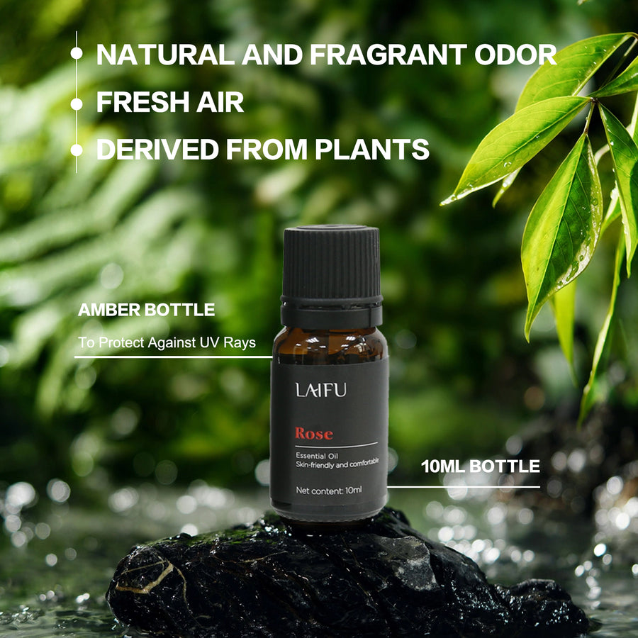 Close-up of LAIFU Rose essential oil in an amber bottle on a wet rock, highlighting UV protection, natural plant derivation, and 10ml capacity.