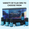 Well-being essential oil gift box with 6 bottles arranged on a black display stand, showcasing the variety of available flavors.