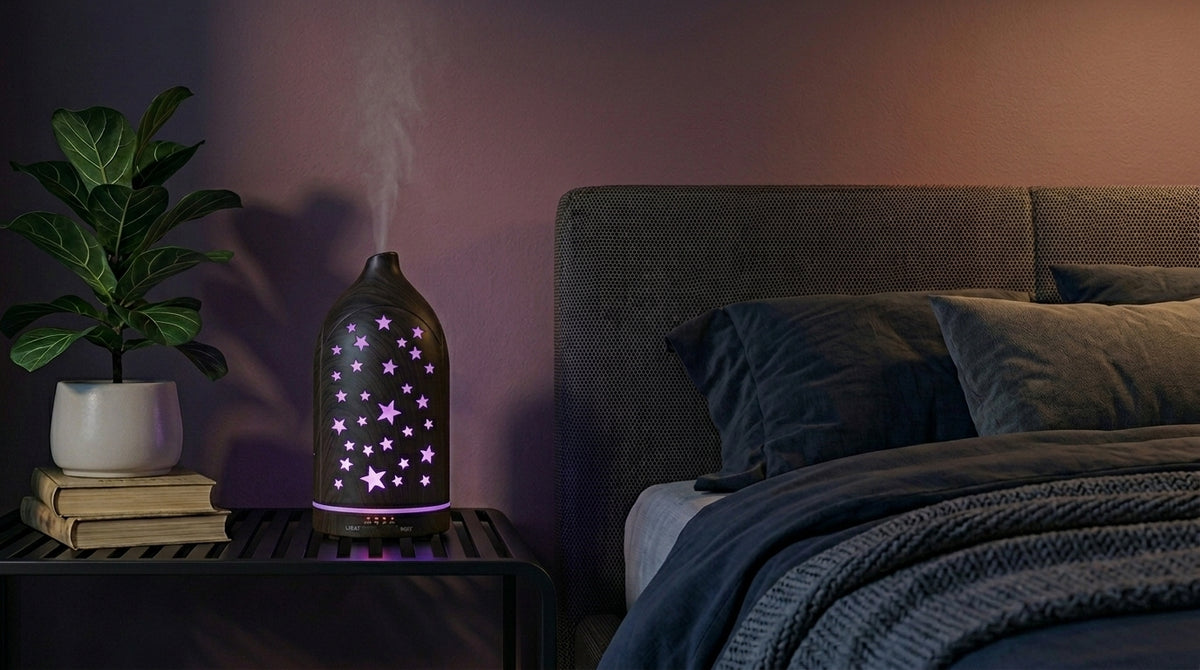 Dark wood grain star cutout diffuser emitting a calming purple starlight glow on a modern nightstand in a dimly lit bedroom, next to a fiddle leaf fig plant.