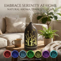 Aurora aromatherapy diffuser with forest cutouts displaying 7 calming light colors in a sunny living room, promoting natural aroma and tranquil light for home.