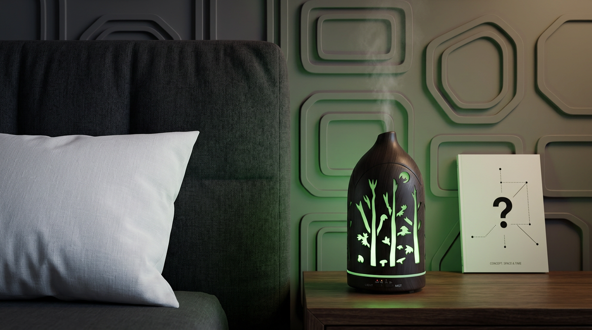 Dark wood forest aromatherapy diffuser emitting a calming light green LED light on a nightstand in a modern bedroom with geometric wall panels.
