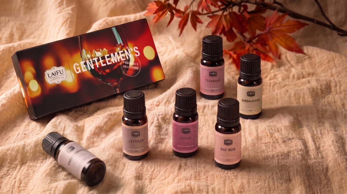 LAIFU Gentlemen's fragrance collection gift box and essential oil bottles arranged on a cozy beige linen fabric with autumn maple leaves.