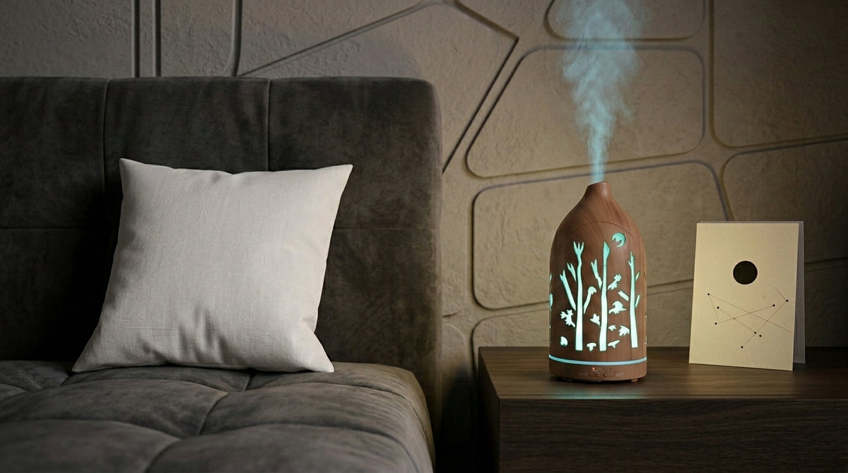 Light wood grain forest cutout diffuser emitting a cool light blue LED light on a dark wooden nightstand in a modern bedroom with geometric wall panels and a constellation card.