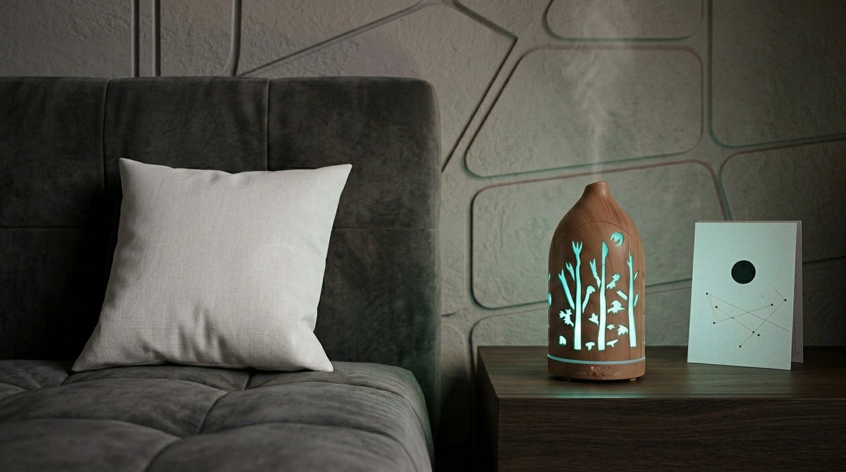 Light wood grain forest cutout diffuser emitting a cool sky-blue LED light on a dark wooden nightstand in a modern bedroom with geometric wall panels and a constellation card.