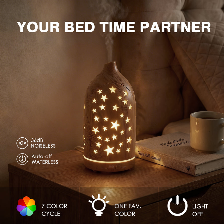 Light wood star diffuser as your bed time partner glowing with warm light on a nightstand, featuring 36dB noiseless operation, auto-off when waterless, and favorite color lock.