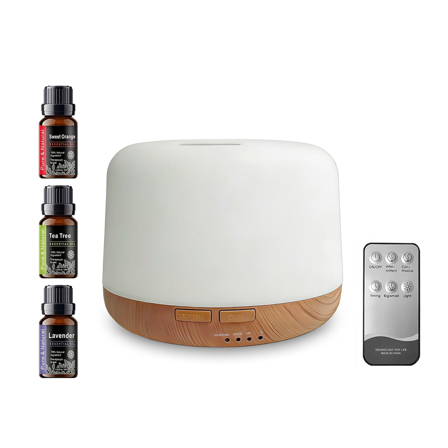 Pniaw 500ml white and wood grain aroma diffuser full set on white background, including remote control and 3-pack essential oils gift set.
