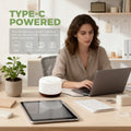Pniaw 500ml diffuser powered by Type-C cable on a woman's office desk, compatible with laptops, power banks, and chargers for versatile use.