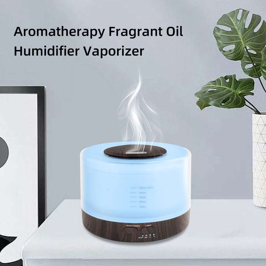 Pniaw dark wood round ultrasonic humidifier vaporizer emitting cool mist with blue LED light, suitable for aromatherapy fragrance oil use.