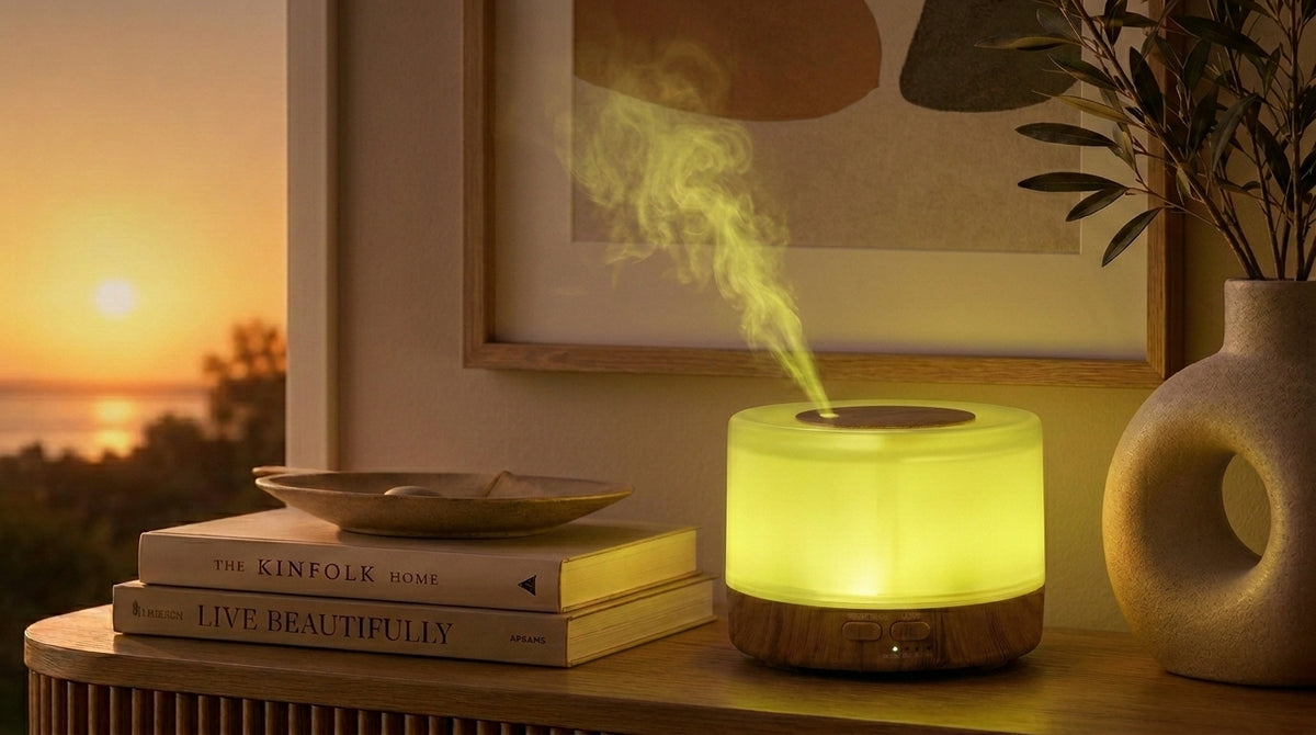 Pniaw round light wood grain diffuser glowing with green yellow LED light on a console table by the sunset window, styled with books and a modern vase.